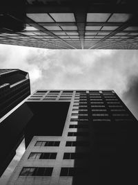 Low angle view of office building against sky