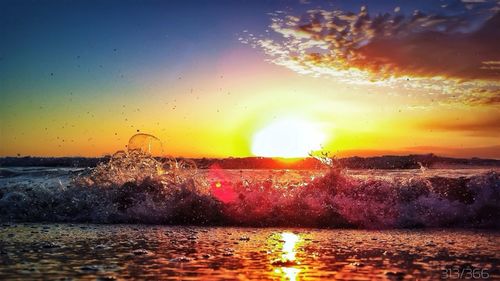 Scenic view of sea at sunset