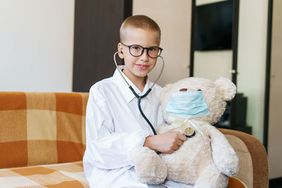 Portrait of boy with toy