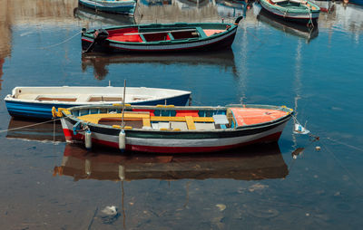 Boats moored in water