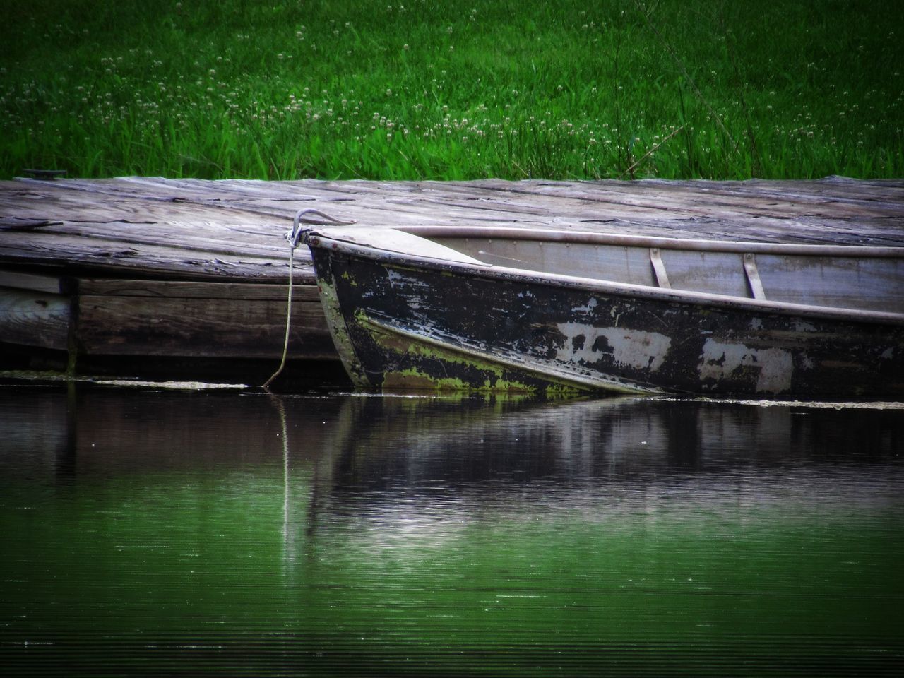 ABANDONED BOAT ON SHORE