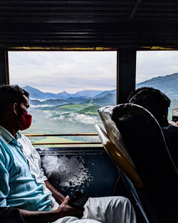 People sitting in car window