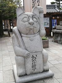 Sculpture of buddha statue outside temple