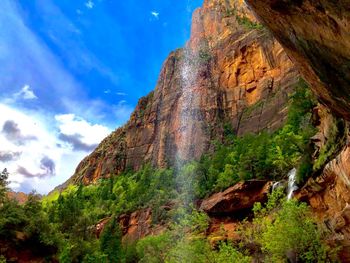 Low angle view of rocks against sky