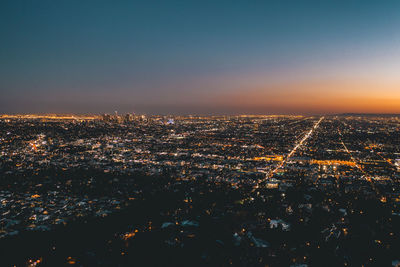 Aerial wide view over glowing los angeles, california city lights scape