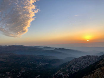 Scenic view of mountains against sky during sunset