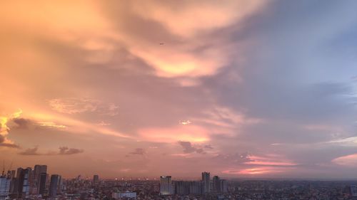 Cityscape against sky during sunset