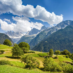 Scenic view of landscape and mountains against sky