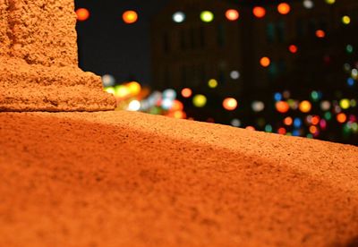 Close-up of illuminated street lights at night
