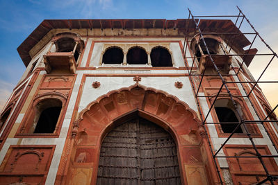 Low angle view of old building against sky