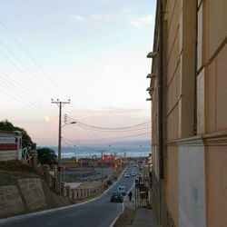 Empty road with buildings in background