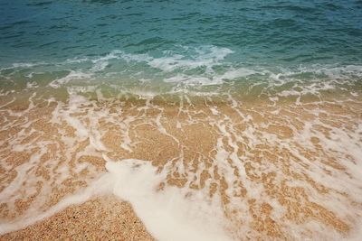 High angle view of surf on beach