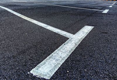 High angle view of arrow symbol on road