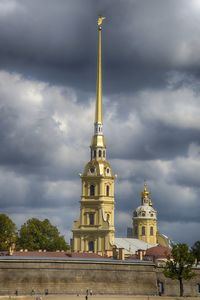 Low angle view of temple against cloudy sky
