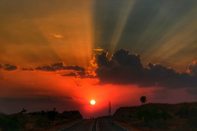 Scenic view of sunset over road