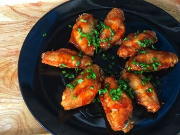 High angle view of meat on barbecue grill
