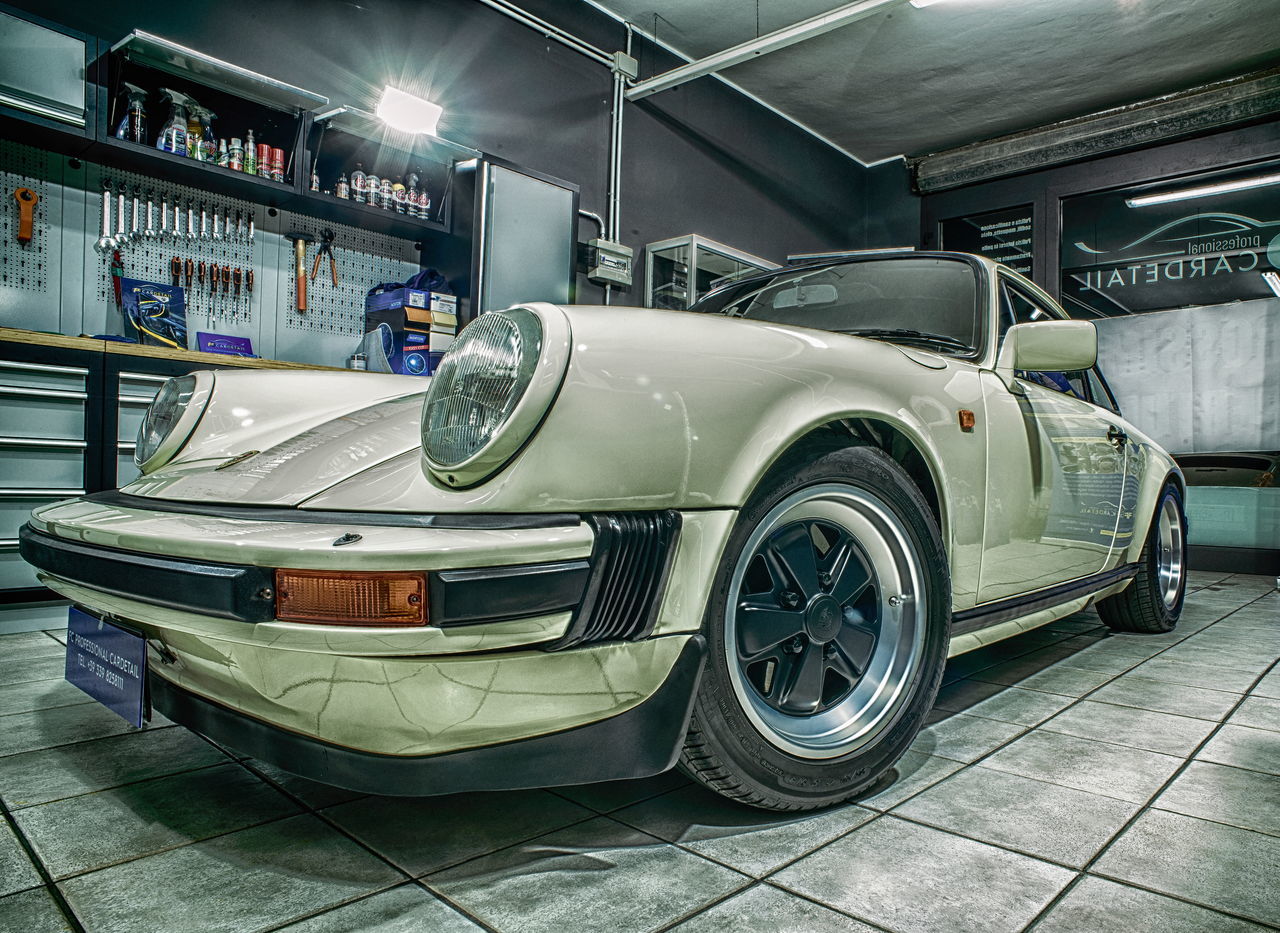 VINTAGE CAR PARKED IN GARAGE