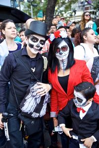 Full length portrait of friends standing on mask