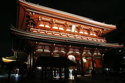 Low angle view of illuminated building at night