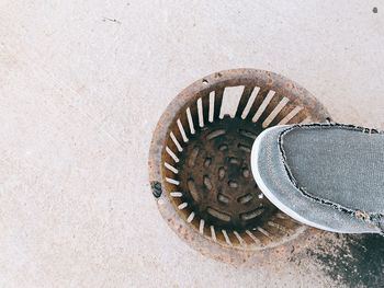 High angle view of manhole on wall