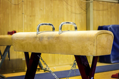 Close-up of empty chairs on table