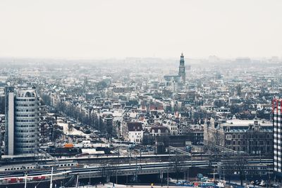 High angle view of city buildings against clear sky