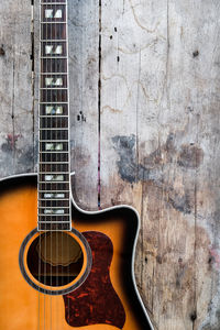 Close-up of guitar against wall