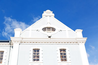 Low angle view of building against blue sky