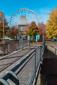 View of amusement park against sky during autumn