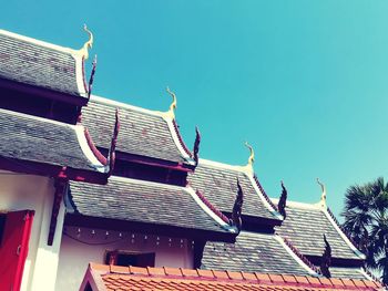 Low angle view of houses against clear sky