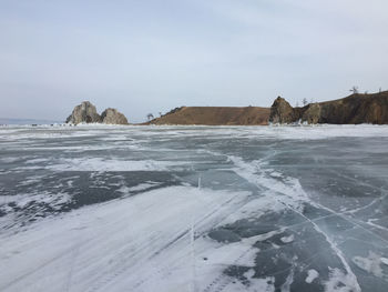 Scenic view of sea against sky during winter