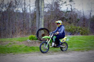 Man riding bicycle in forest