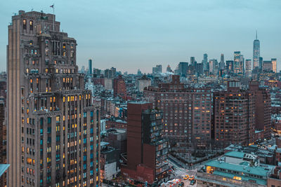 High angle view of modern buildings in city against sky