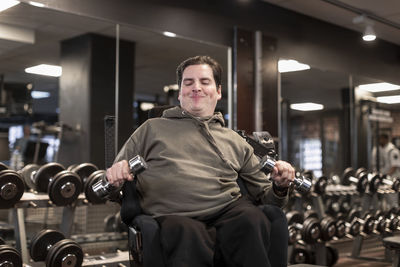 Man on wheelchair training in gym