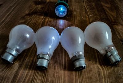 High angle view of light bulb on table