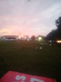 Scenic view of field against sky during sunset