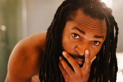 Close-up portrait of mid adult man