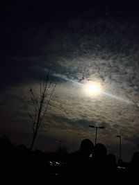 Low angle view of silhouette trees against sky at sunset