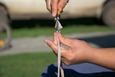 Midsection of person holding hands