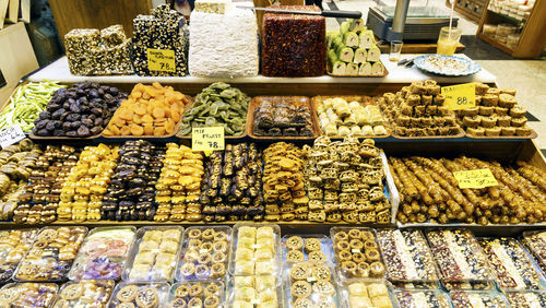 High angle view of sweet food arranged at market for sale