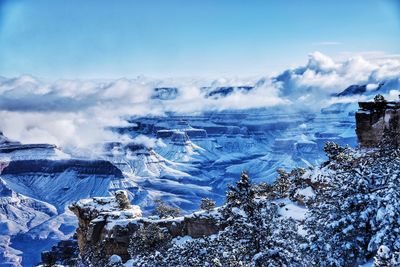 Aerial view of snowcapped mountains against sky