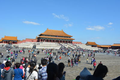 Group of people in front of historical building
