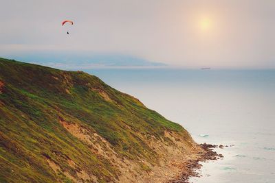 Scenic view of sea against sky at sunset