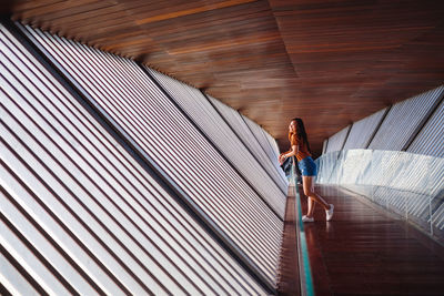 Rear view of woman walking on staircase