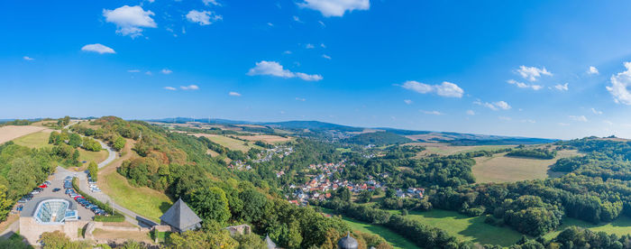 Scenic view of landscape against blue sky