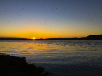 Scenic view of sea at sunset