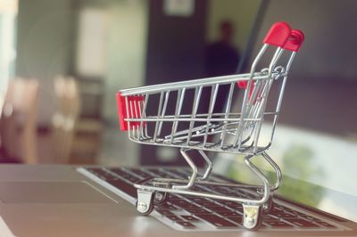 Close-up of shopping cart on laptop