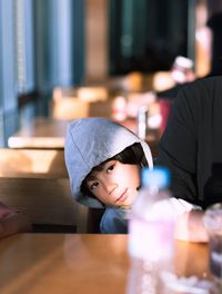 Close-up portrait of boy at table