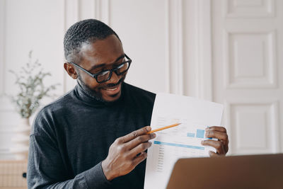 Portrait of young man working at home