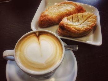 Close-up of cappuccino on table